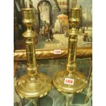 A pair of George III brass candlesticks, 25cm high.