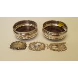 A pair of silver bottle coasters, by B & Co, Birmingham 1981, having turned hardwood bases,