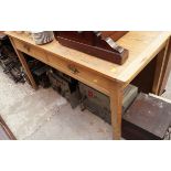 An antique pine table, with two frieze drawers, 132cm long.