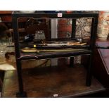 A Chinese ebonized two tier rectangular occasional table, 61cm wide.