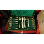 A cased set of twelve silver plated teaspoons, with sugar tongs and two jam spoons and butter