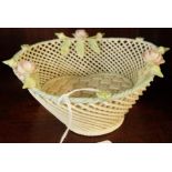 A Belleek trefoil basket, 17cm wide.