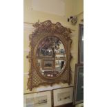 A 19th century carved gilt wood and gesso framed wall mirror, 105 x 81.5cm.