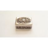 A Chinese metal box, relief moulded with dragons, 6.4cm wide.