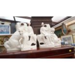 A pair of Victorian white glazed Staffordshire spaniels, 34.