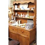 A reproduction oak linenfold dresser and rack, 95cm wide.