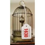 A brass novelty 'bird in cage' clock, 13.5cm high.