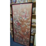 A large Chinese silk needlework panel of figures in a garden, 143 x 67cm.