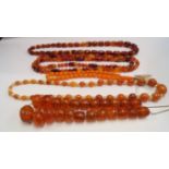 Five amber style bead necklaces.