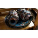 A pair of Japanese cloisonne enamel chargers, each decorated with a bullfinch,