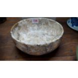 A pudding stone style circular bowl, 21.5cm diameter.