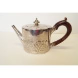 A George III silver drum teapot, by Septimus and James Crespell, London 1768, chased with diaper