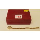 A Rodania 9ct gold ladies wristwatch, on gold plated bracelet.