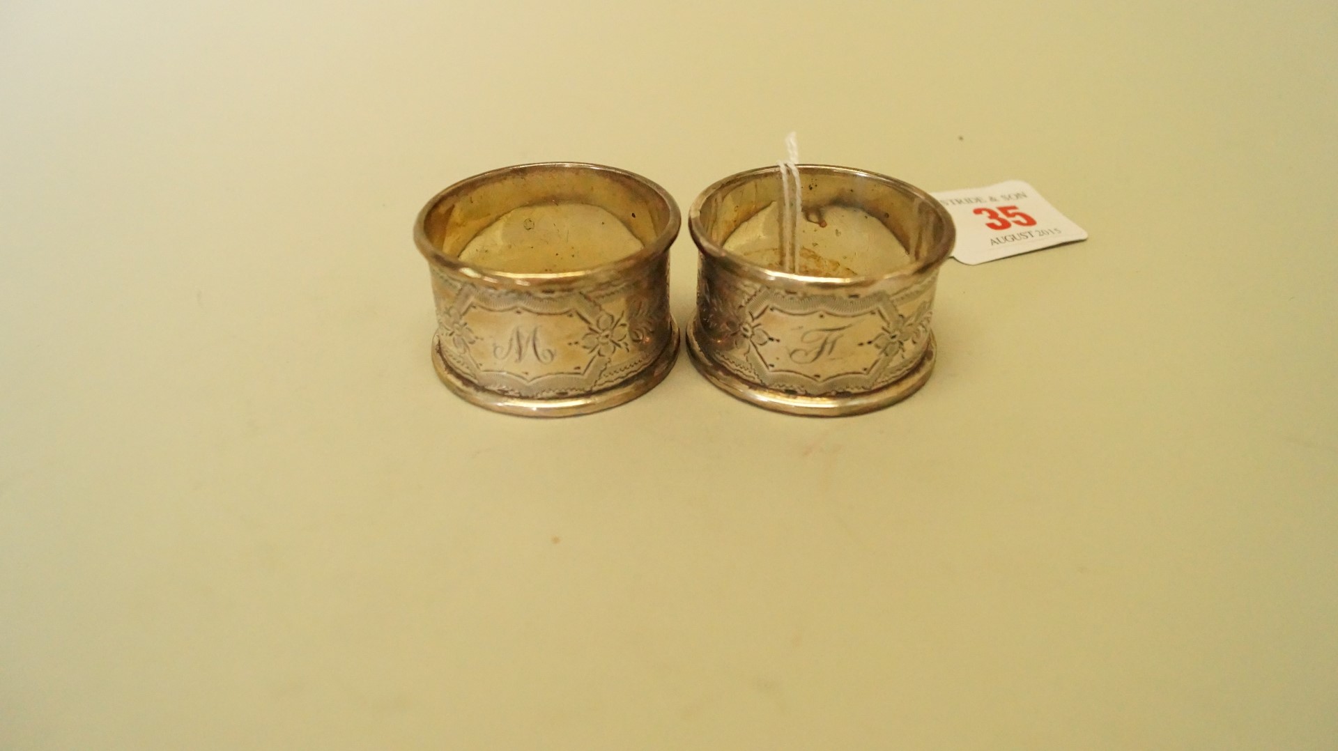 A cased pair of Edwardian silver napkin rings, Birmingham 1906, 50.9g. - Image 4 of 4