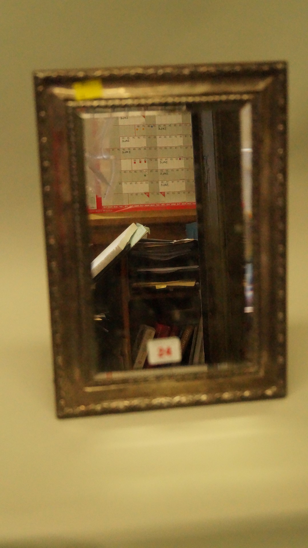 A silver easel mirror, Birmingham 1911, 34cm by 23.5cm. Condition Report: Some denting and minor