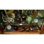 A collection of glass paperweights,