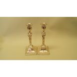 A pair of late Victorian Sheraton revival silver candlesticks, by Thomas Bradbury & Sons Ltd,