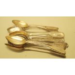 Ten various continental .800 teaspoons and one plated teaspoon.