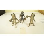 A pair of early 20th century cold painted bronze cats, each holding a sword,