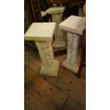 A pair of marble effect pedestals, 62cm high.