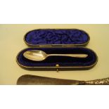 A cased silver spoon, by Wakely & Wheeler, London 1912, 21g; together with a small silver trumpet