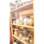 Studio Pottery: a collection of vases and bowls, (two shelves).