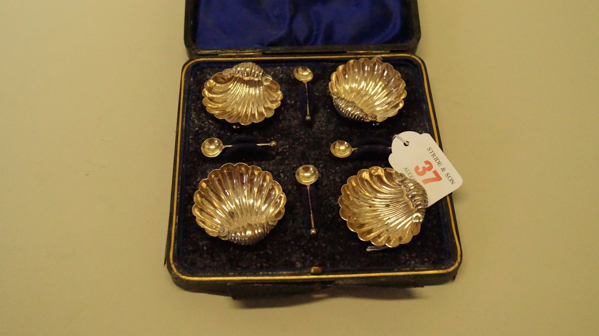 A cased set of four late Victorian silver shell shaped salts and spoons,