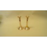 A pair of silver candlesticks, by B & Co, Birmingham 1998, 18.5cm, filled.