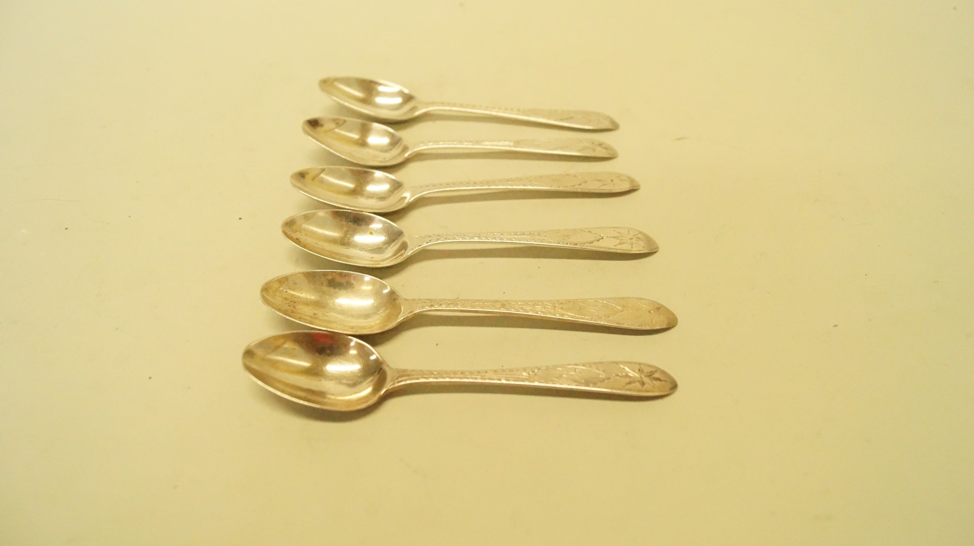 A six similar Irish silver bright cut teaspoons, by John Smith, Dublin 1910, 75.9g.