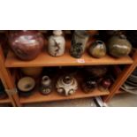 Studio Pottery: a mixed collection of vases, bowls and similar, (three shelves).