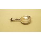 An Arts & Crafts silver tea caddy spoon, by A E Jones, Birmingham 1919. Condition Report: The