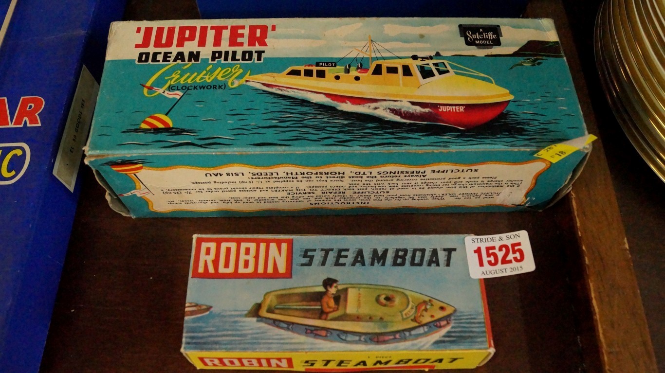 A 1960s Sutcliffe Jupiter Ocean Pilot Cruiser, boxed; together with a Robin steam boat, boxed.