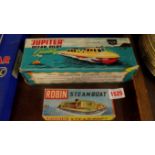 A 1960s Sutcliffe Jupiter Ocean Pilot Cruiser, boxed; together with a Robin steam boat, boxed.