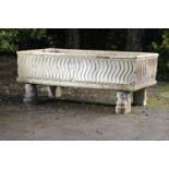 An unusual carved Istrian stone trough  Italian, 19th century 94cm.; 37ins high by 232cm.; 91ins