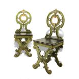 Garden Seat: A pair of rare cast iron chairs  circa 1870 with wooden seat 97cm.; 38ins high