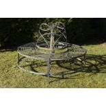 Garden Seat: A Regency reeded wrought iron tree seat in two halves  early 19th century