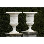 Garden Urn: A pair of carved white marble urns  Italian, late 19th century 74cm.; 29ins high
