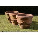 Garden Urn: A set of three Compton terracotta apple pots  early 20th century  with small circular