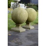 A pair of composition stone gatepier balls    modern  84cm.; 33ins high