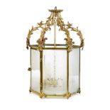 A Rococo style gilt brass hexagonal lantern    early 20th century   with frosted glass panels