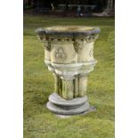 A Victorian carved sandstone font    circa 1870  107cm.; 42ins high by 84cm.; 33ins wide  base