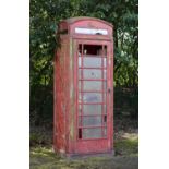 A K6 telephone box    mid 20th century  cast iron and glazed  230cm.; 91ins high    Originally
