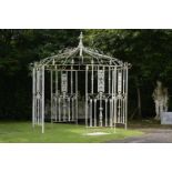 An octagonal wrought iron gazebo     2nd half 20th century  305cm.; 120ins high by 274cm.; 108ins