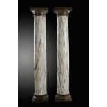 A pair of bronze mounted Skyros marble columns    late 19th century  216cm.; 85ins high by 41cm.;
