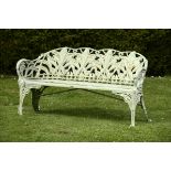 Garden Seat:A similar Coalbrookdale Lily of the Valley pattern cast iron seat  157cm.; 62ins long