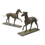 Two bronze whippets in the style of Joseph Gott  late 20th century weathered outdoor patina on