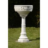 A carved white marble bowl on stand  Italian, late 19th century 134cm.; 53ins high by 74cm.; 29ins