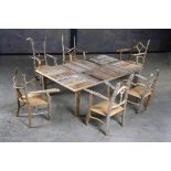 The accompanying suite of furniture comprising a table and six chairs by Silas Birtwistle the