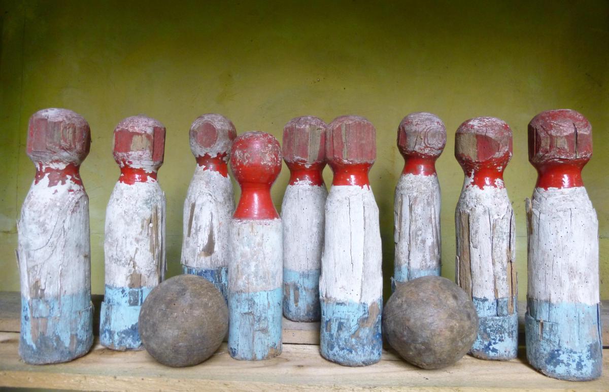 A set of nine Showground or ‘Pub’ skittles  English, circa 1900 crudely made and painted, together