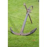 A cast iron anchor  early 20th century 180cm.; 71ins high, the fluke 114cm.; 45ins wide
